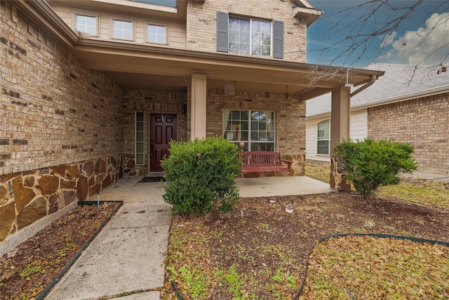 doorway to property featuring a porch