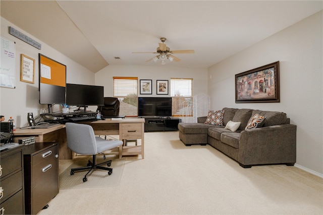 carpeted home office featuring ceiling fan