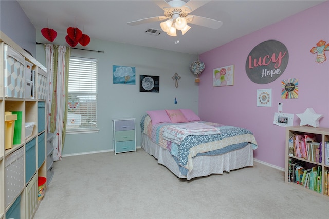 bedroom featuring ceiling fan and carpet