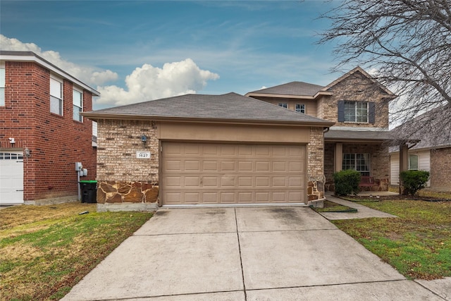 view of front of property featuring a garage and a front yard