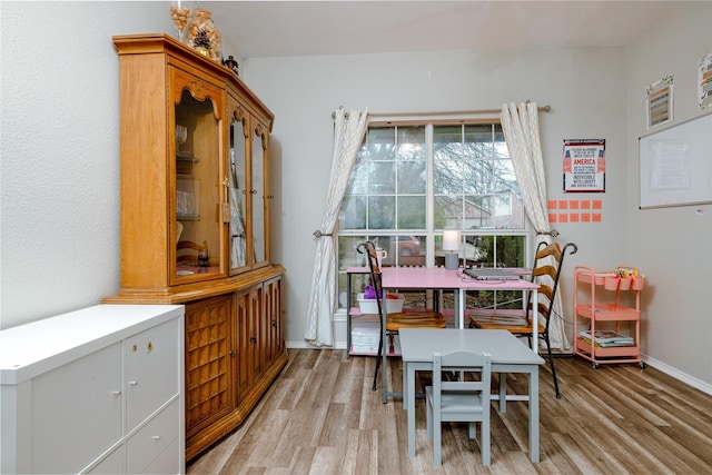 dining area featuring light wood-type flooring