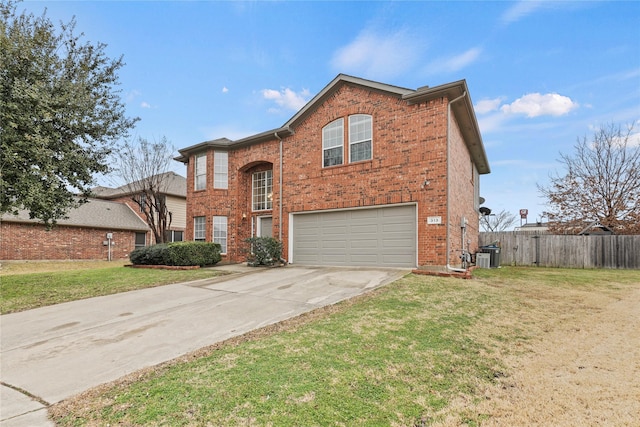 front of property featuring a garage, central AC unit, and a front yard