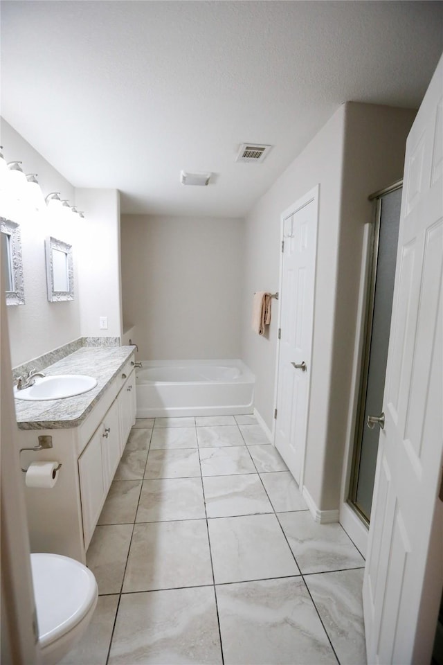 full bathroom featuring vanity, independent shower and bath, and toilet