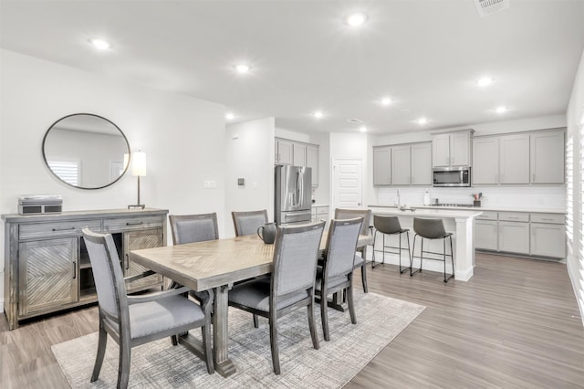 dining room featuring light hardwood / wood-style floors