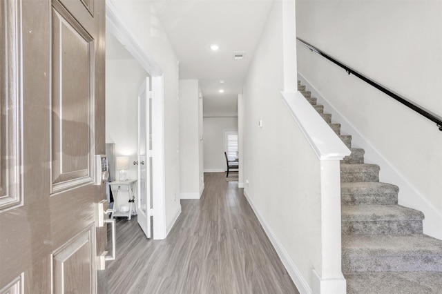 foyer entrance with light hardwood / wood-style floors