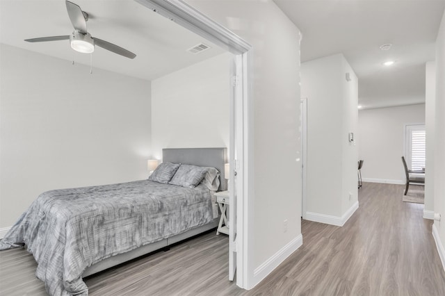 bedroom featuring light hardwood / wood-style flooring and ceiling fan