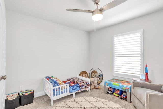 carpeted bedroom featuring ceiling fan