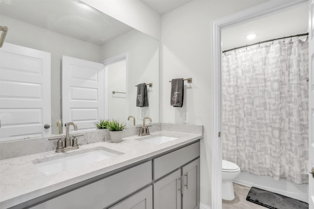 full bathroom with vanity, toilet, and shower / bath combo with shower curtain