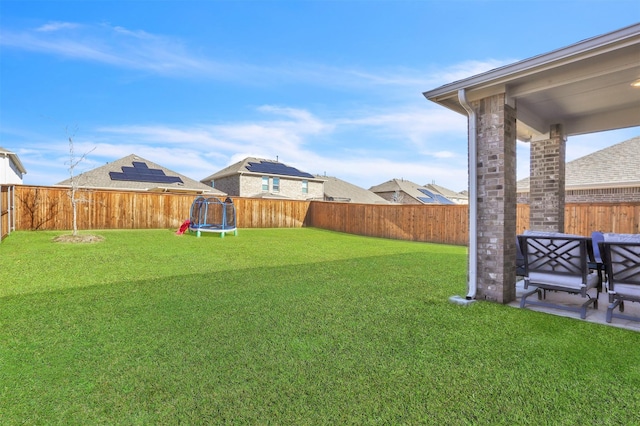 view of yard featuring a trampoline