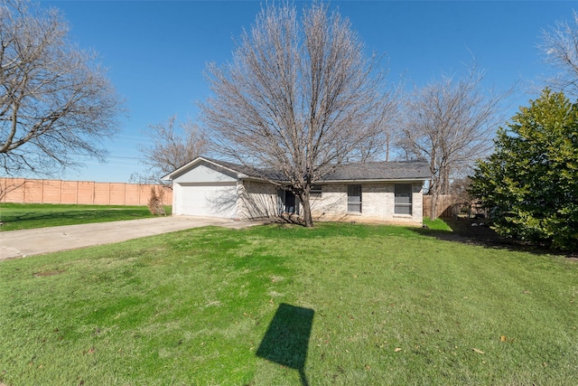 ranch-style house with a garage and a front yard