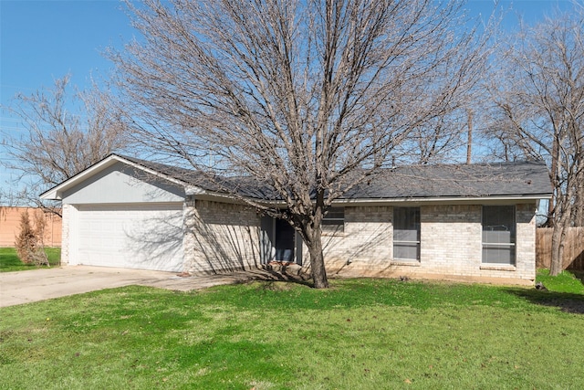 single story home featuring a garage and a front yard