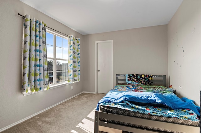 bedroom featuring light colored carpet