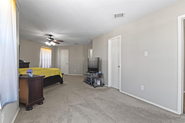 bedroom featuring light colored carpet and ceiling fan