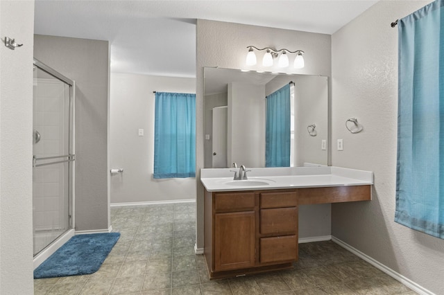 bathroom with vanity and an enclosed shower