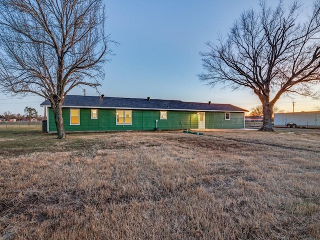 view of back of house at dusk