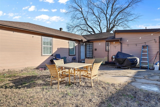 back of property featuring a patio area