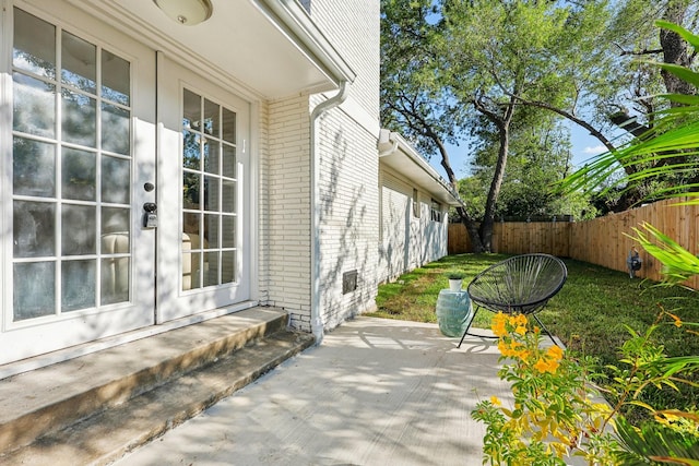 view of patio / terrace with french doors and fence