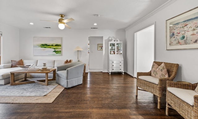 living room featuring crown molding, ceiling fan, and dark hardwood / wood-style flooring