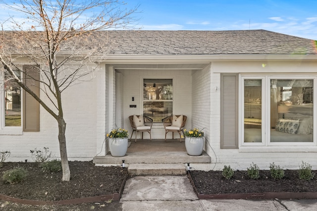 view of exterior entry with covered porch