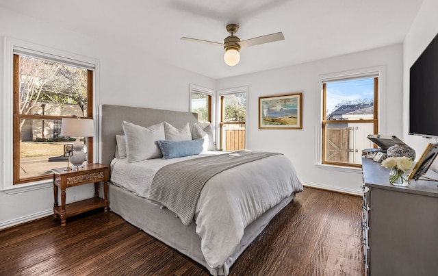 bedroom with dark wood-type flooring and ceiling fan