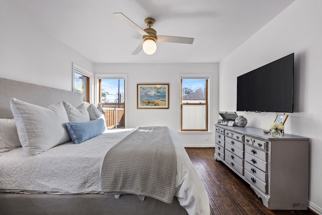 bedroom with ceiling fan and dark hardwood / wood-style flooring