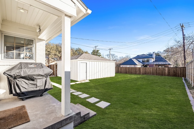 view of yard featuring a patio and a storage unit