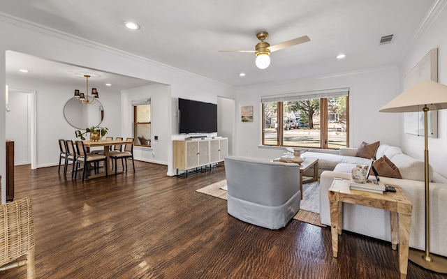 living room featuring ornamental molding, dark hardwood / wood-style floors, and ceiling fan