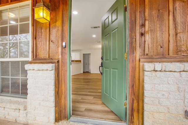 property entrance featuring visible vents