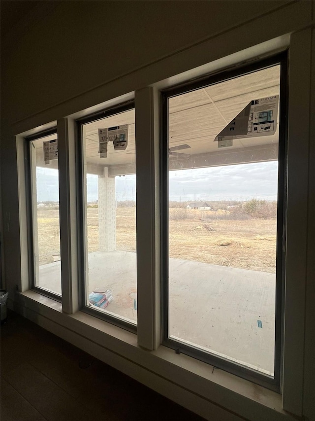 doorway to outside featuring a rural view