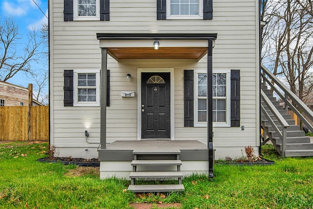 property entrance featuring a yard