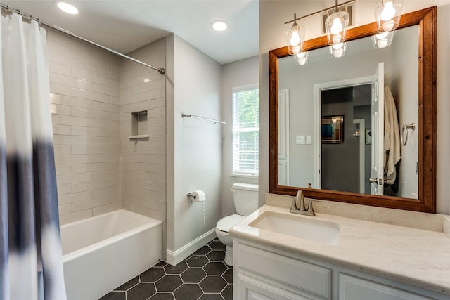 full bathroom featuring vanity, shower / bath combo, tile patterned floors, and toilet