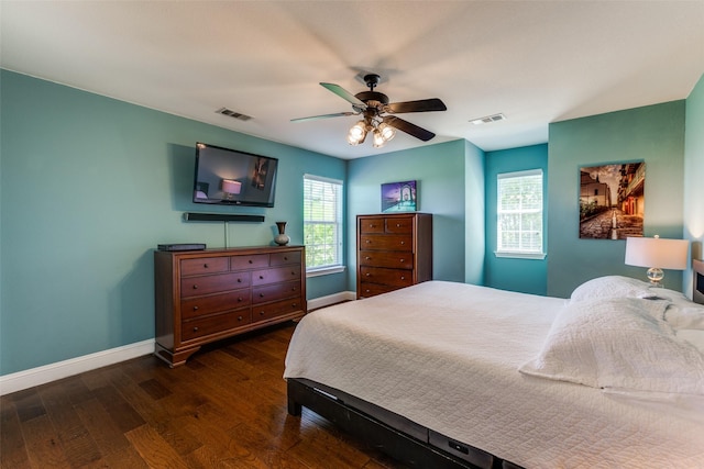 bedroom with dark wood-type flooring and ceiling fan