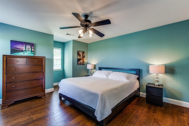 bedroom featuring ceiling fan and dark hardwood / wood-style flooring