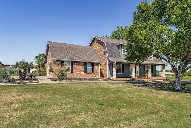 view of front of property with a porch and a front lawn