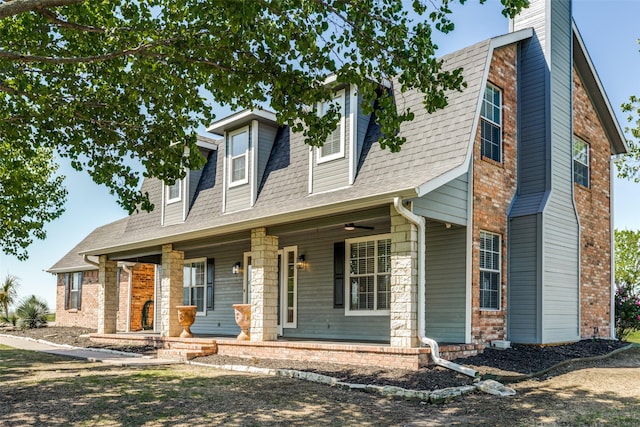 new england style home with covered porch