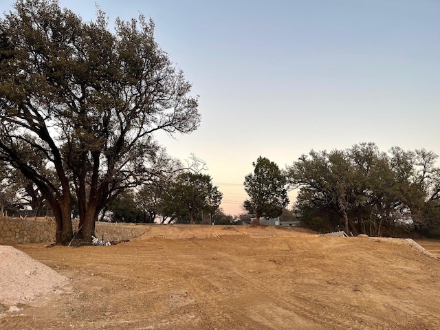 view of yard at dusk