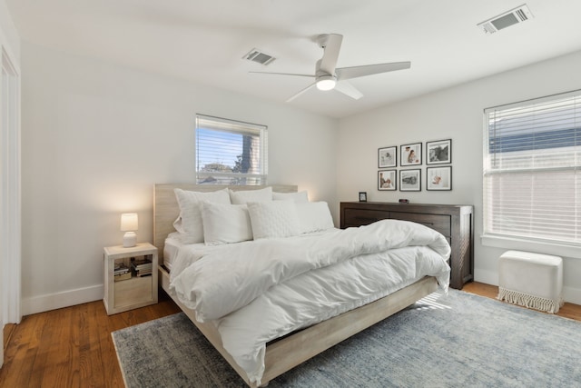 bedroom featuring dark wood-type flooring and ceiling fan