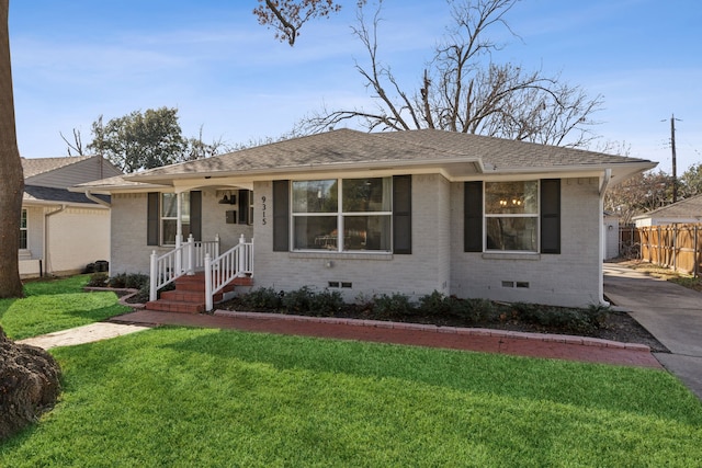 ranch-style home with a front yard