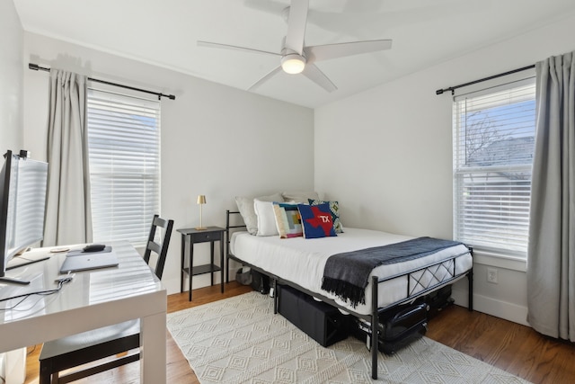 bedroom with ceiling fan and light wood-type flooring