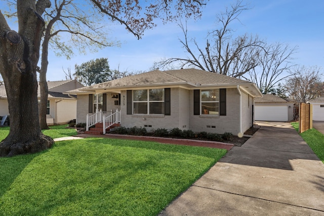 ranch-style house with a garage, an outdoor structure, and a front lawn