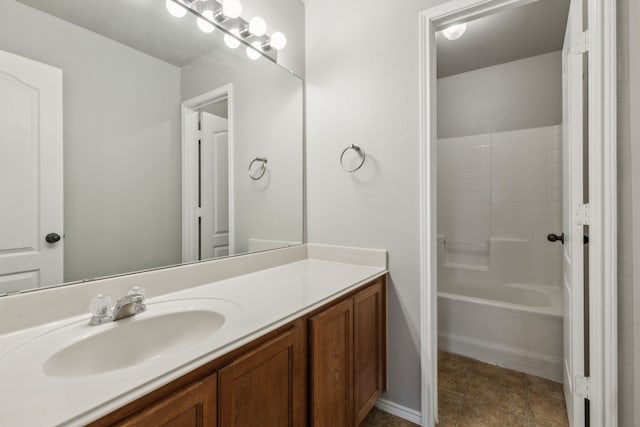 bathroom with vanity, tile patterned floors, and  shower combination