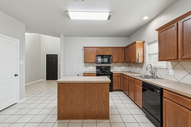 kitchen featuring a kitchen island, sink, light tile patterned floors, and black appliances