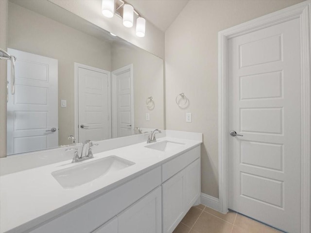 bathroom with tile patterned floors and vanity