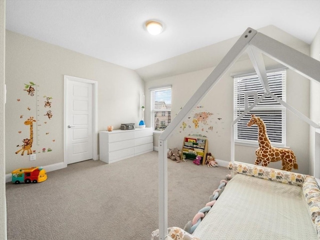 carpeted bedroom featuring vaulted ceiling