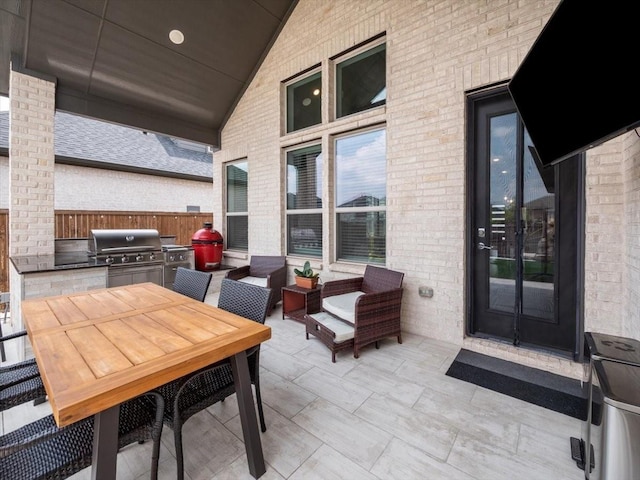 view of patio featuring an outdoor kitchen and grilling area