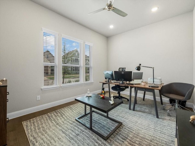 office with dark hardwood / wood-style floors and ceiling fan