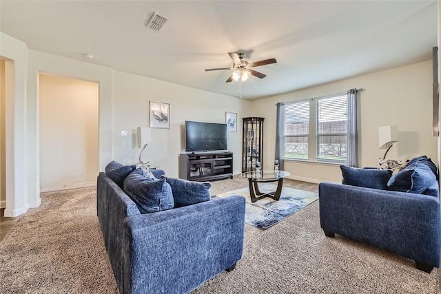 living room with carpet flooring and ceiling fan