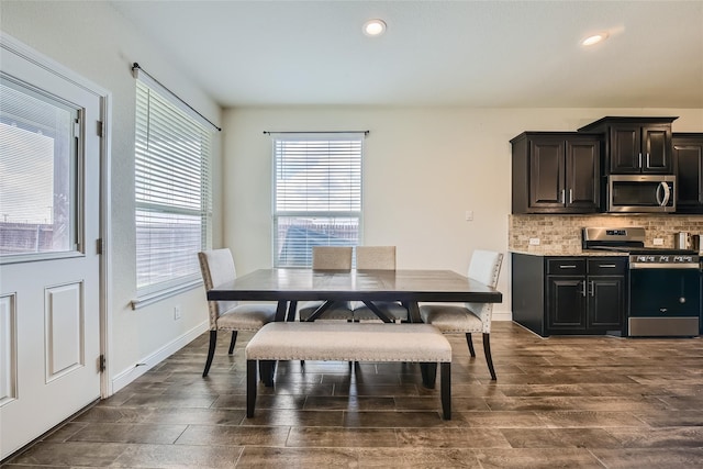 dining area featuring dark wood-type flooring