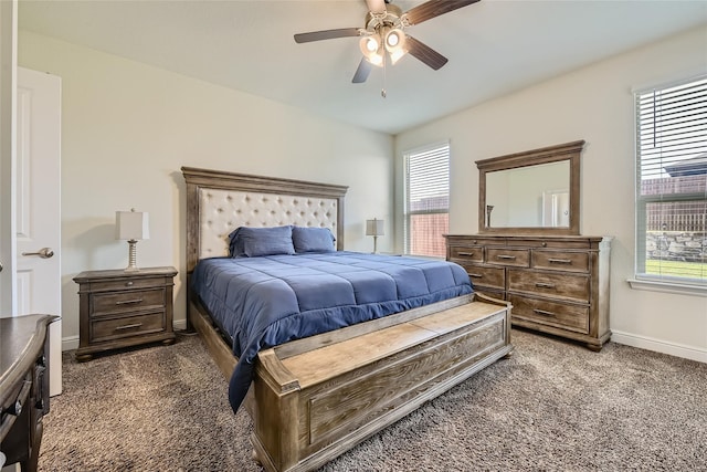 carpeted bedroom with ceiling fan and multiple windows