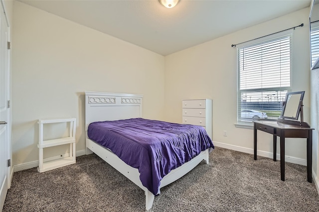 bedroom featuring dark colored carpet